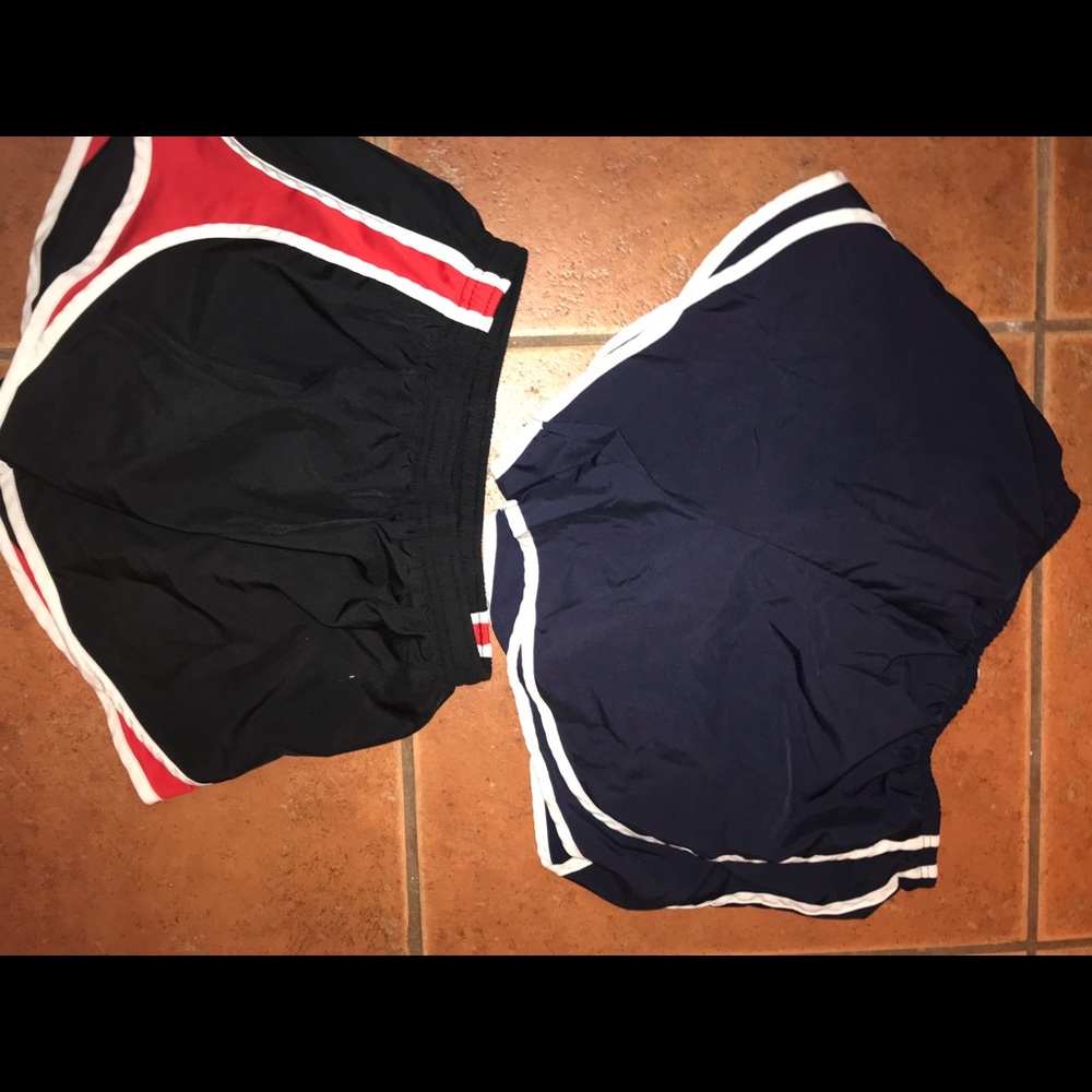 One blue workout shorts and one black and red